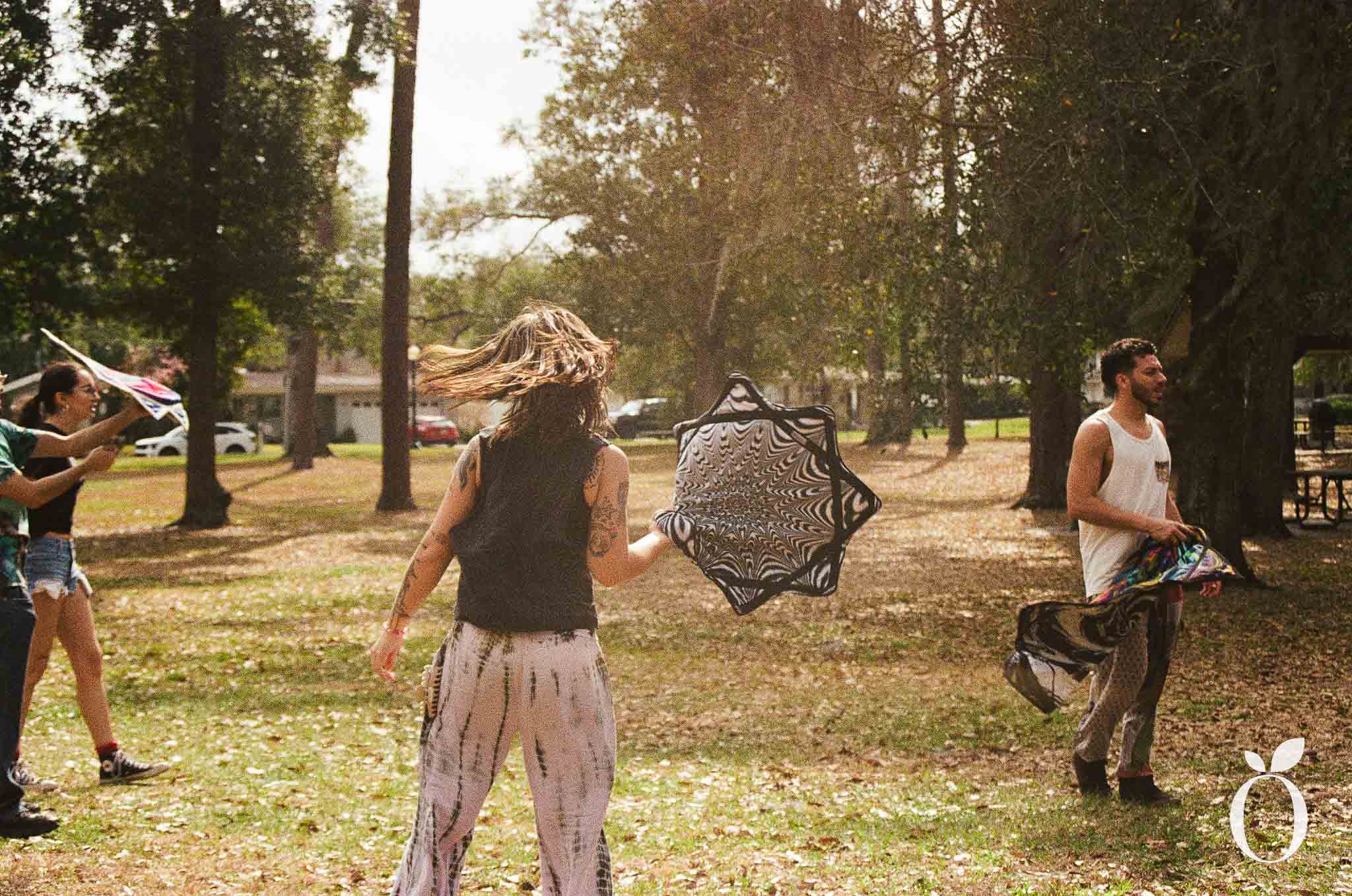 Participants learning flow arts at Orlando Flows community meetup