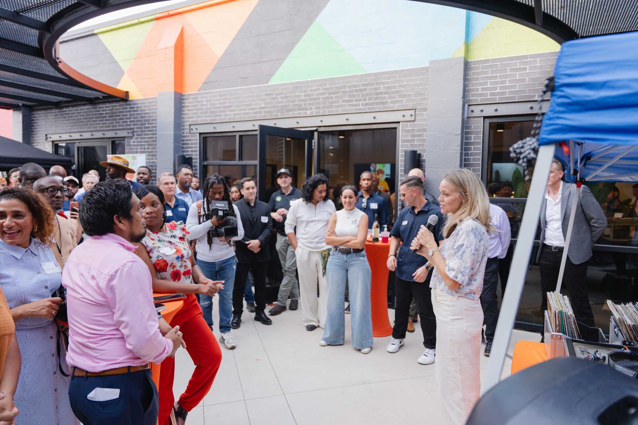 Julia Young shares the mission of Page 15 with guests at Third Thursday at Interstruct Design and Build in Parramore